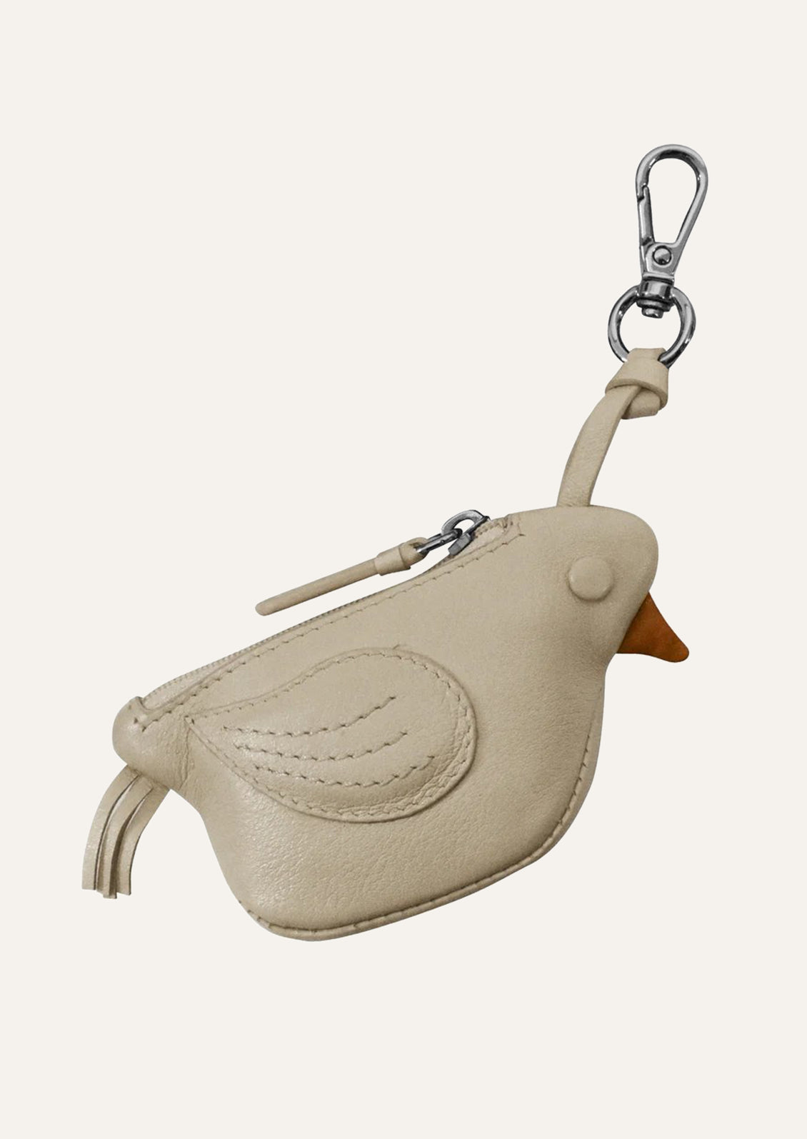 A small stone colored leather pouch in the shape of a canary.
