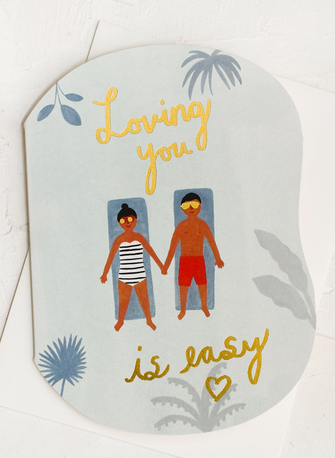 A card with two figures lounging in a pool.