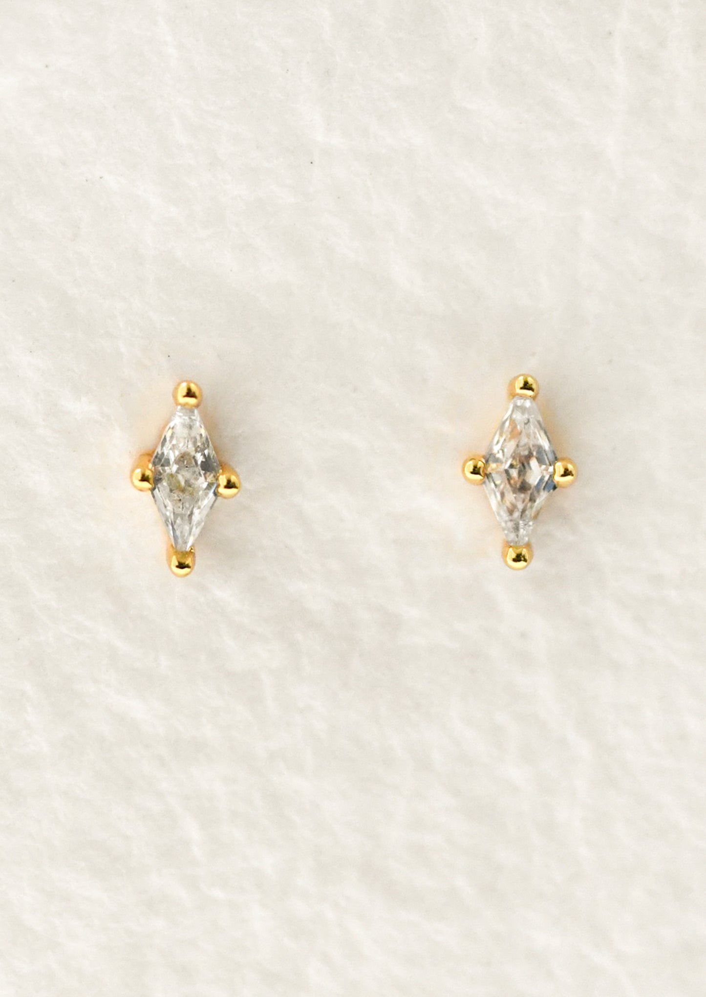 A pair of marquise stud earrings.