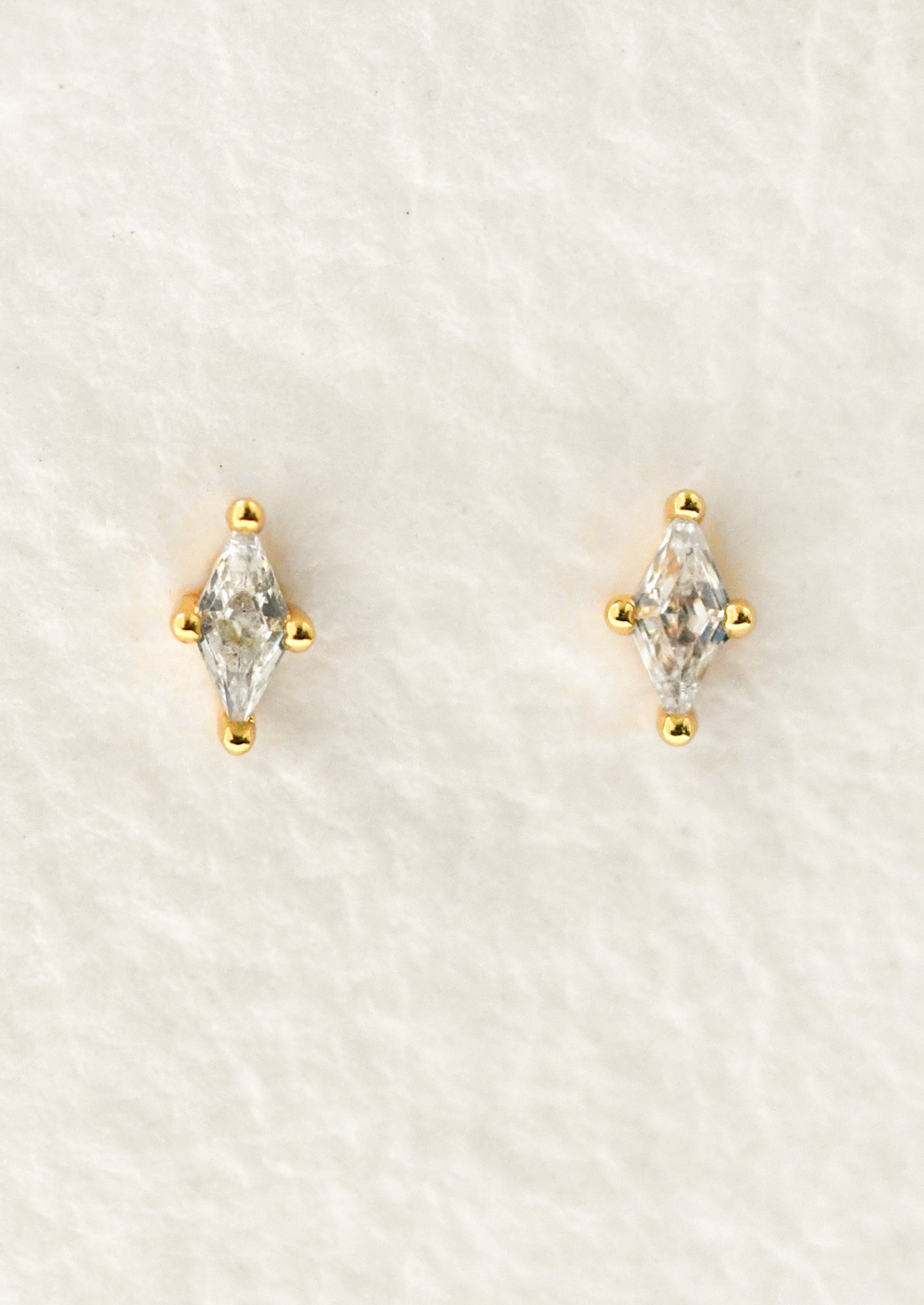 A pair of marquise stud earrings.