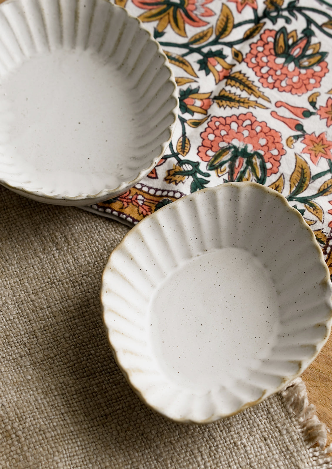 Pleated stoneware dishes in assorted shapes.