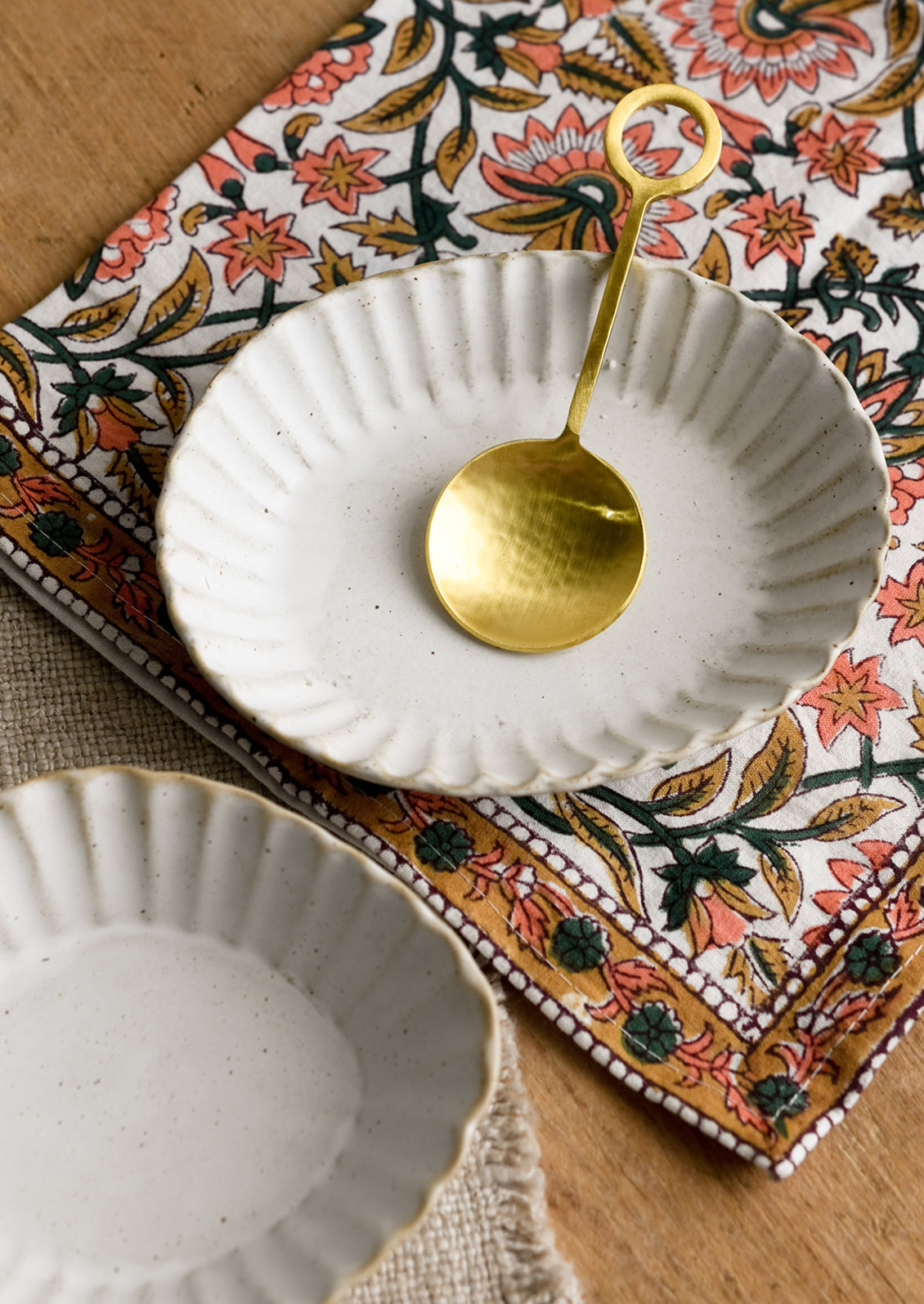 Pleated stoneware dishes in assorted shapes.