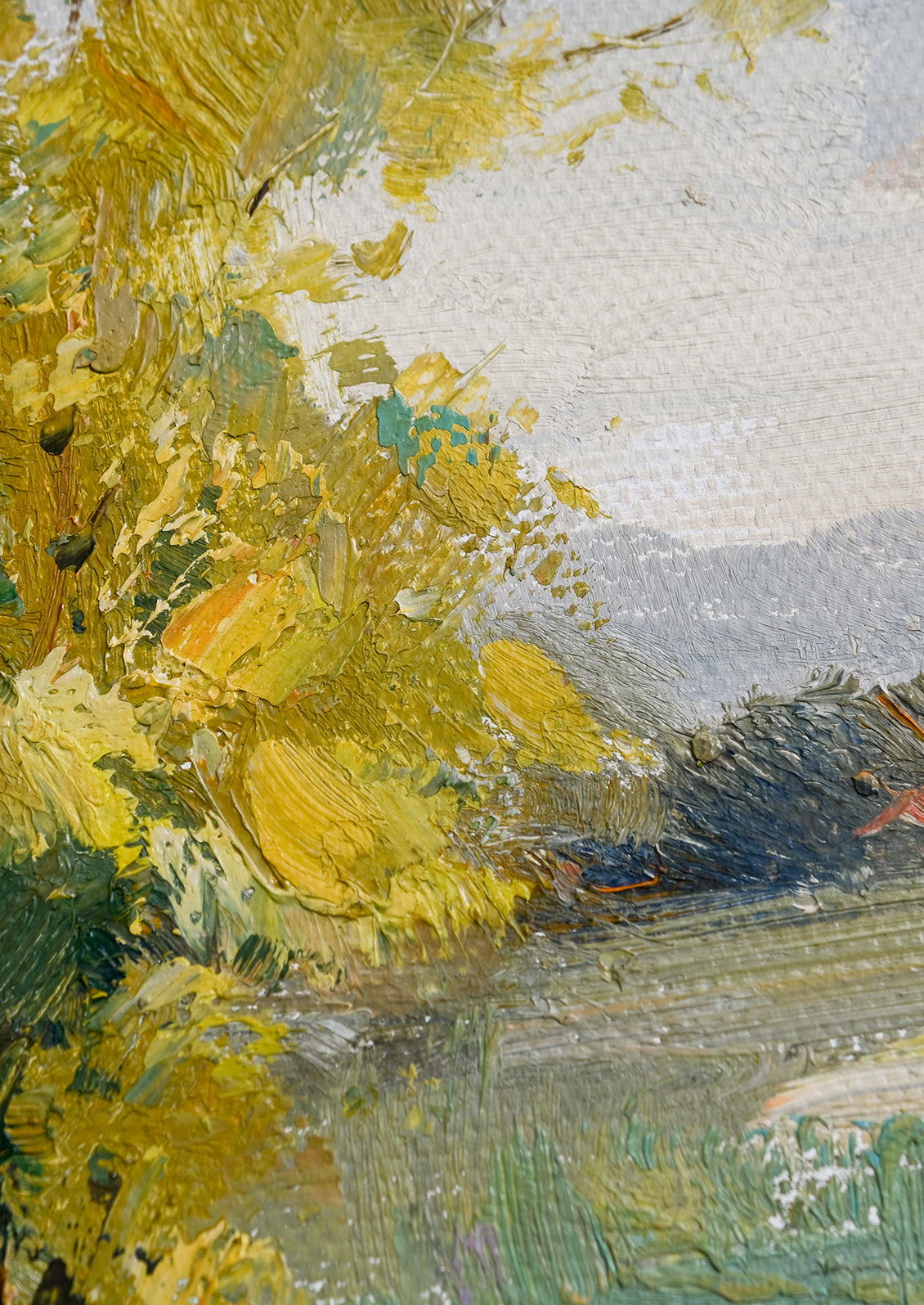 A framed original oil painting of colorful meadow.