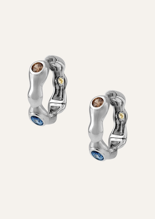 A pair of sterling silver earrings with various colored gemstones.