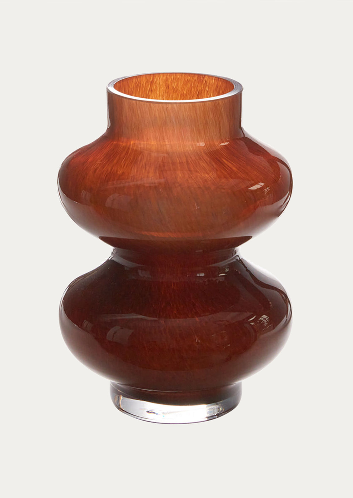 A brown glass vase with hourglass shape.