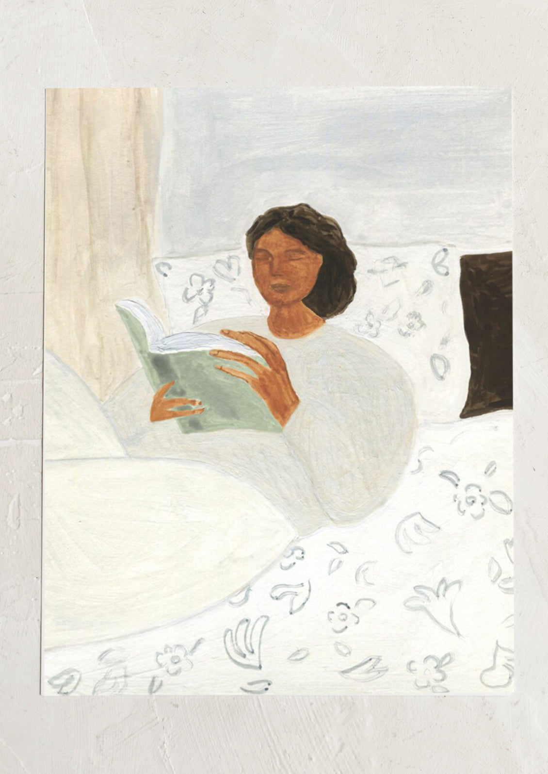 An art print of a painting of a woman laying in bed reading a book.