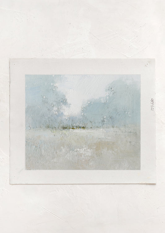 An original oil painting on unstretched canvas of pale colored landscape.