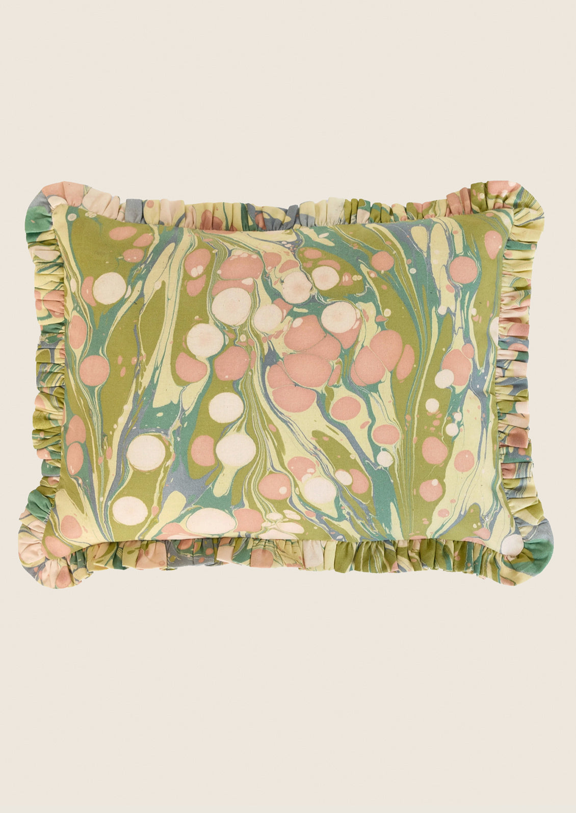 Decorative pillow with marbleized pattern and ruffled edges on a white background