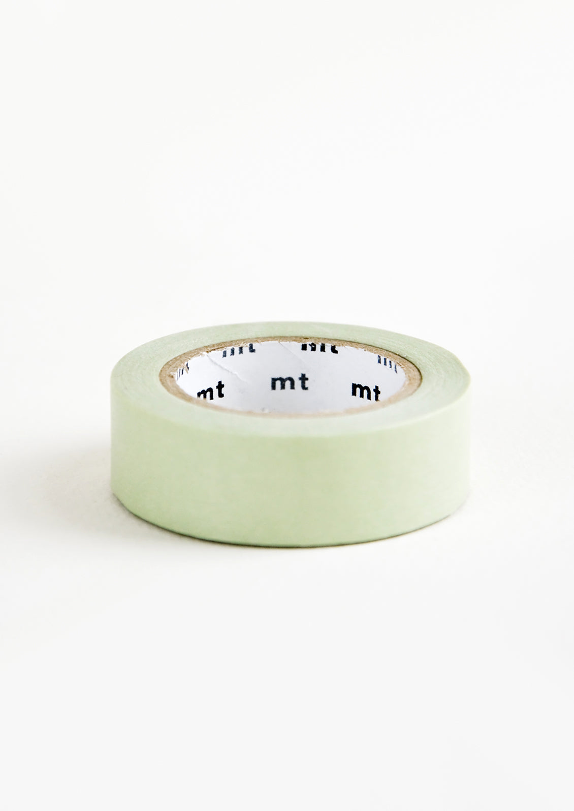 A roll of washi tape in pale green color.