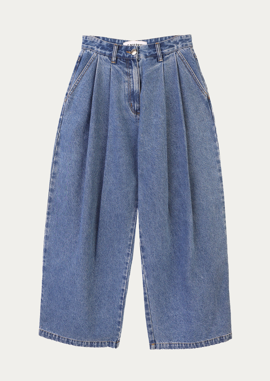 A pair of baggy pleat front jeans in medium blue wash.