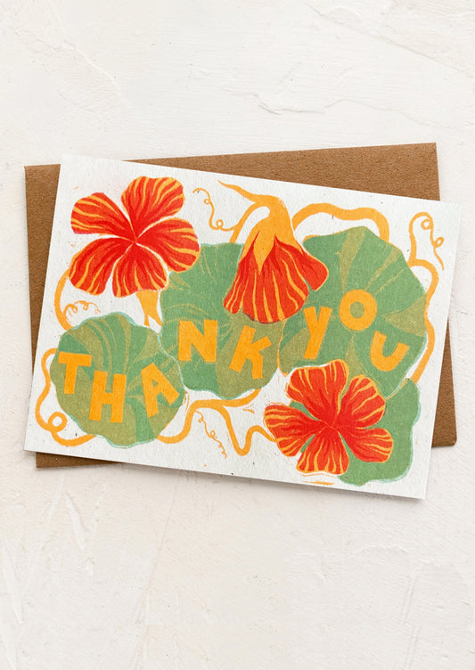 A nasturtium print greeting card with "Thank you" text.