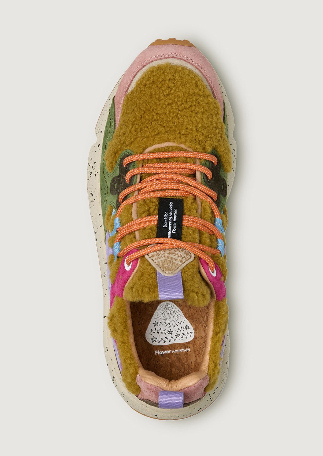 A pair of sporty sneakers in bright multicolor with ochre shearling upper.