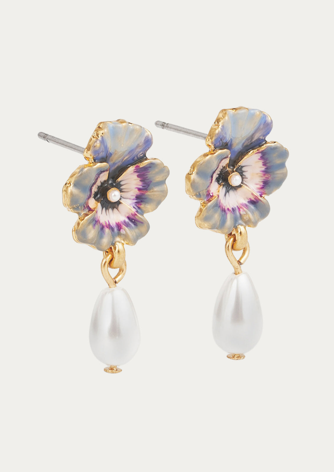 A pair of violet pansy flower earrings with a faux pearl drop.