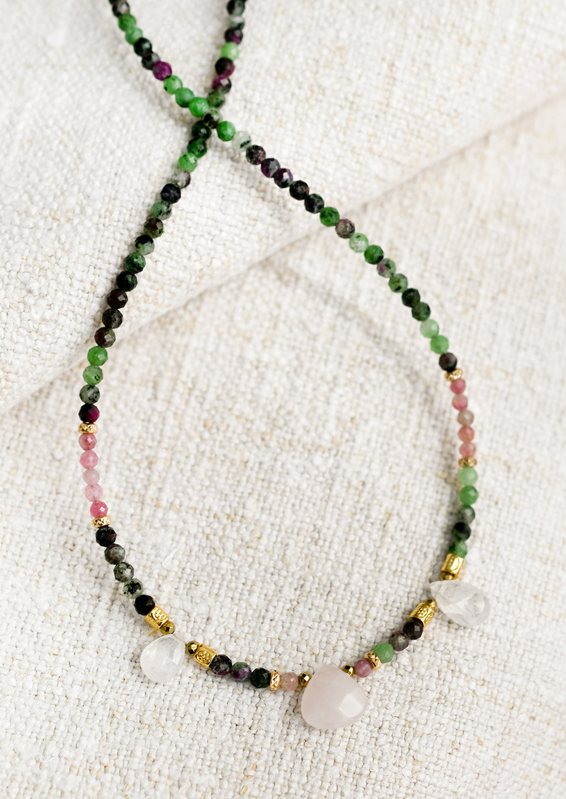 A beaded necklace made of moonstone and rubies.