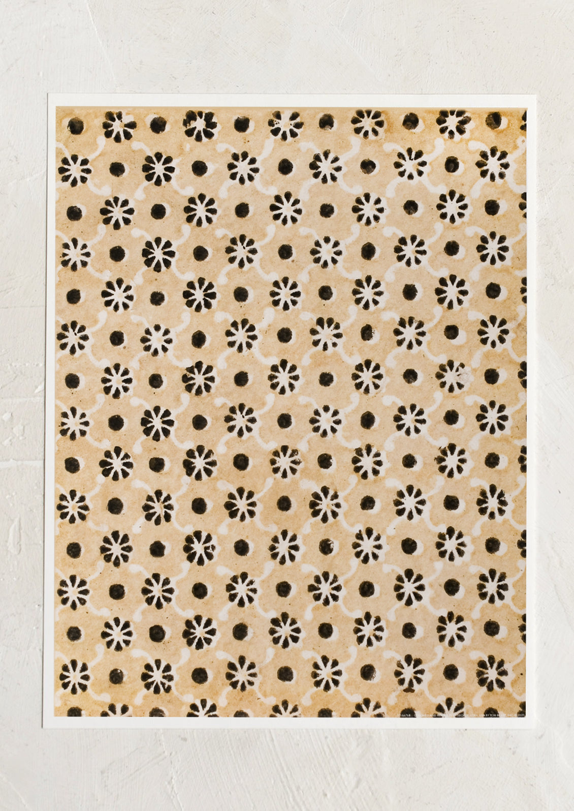 An art print that looks like a block printed textile in beige and black flower pattern.