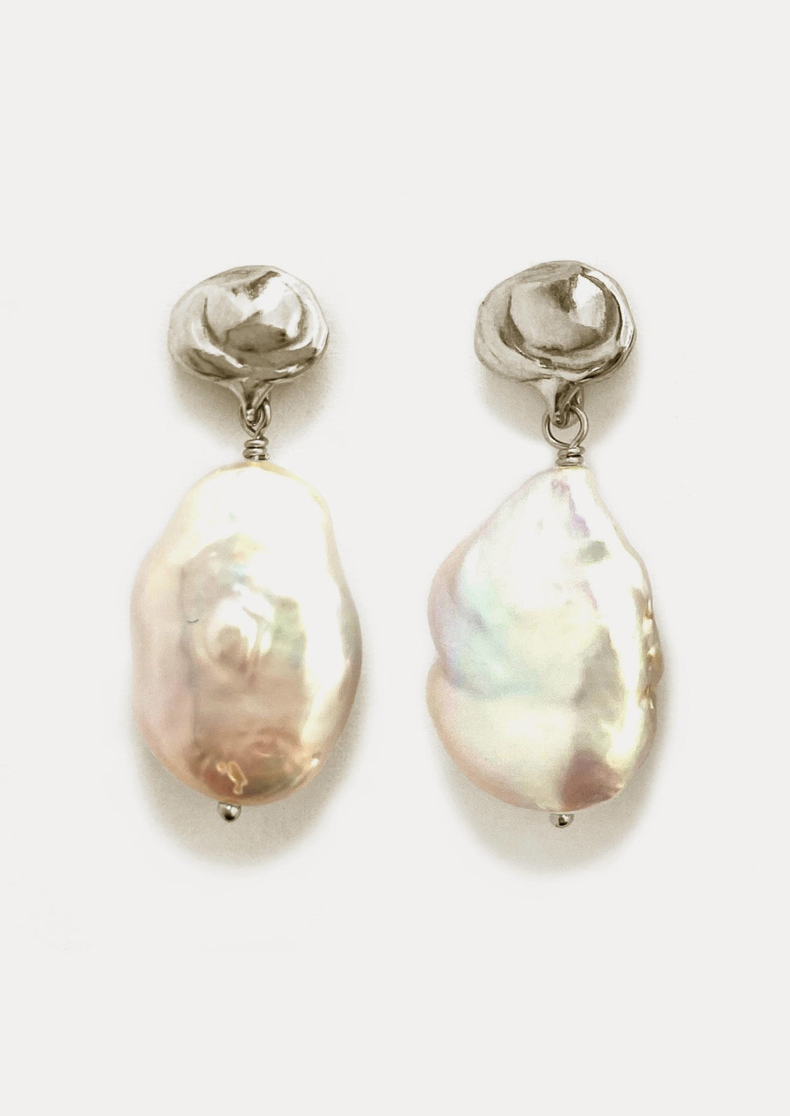 A pair of baroque pearl and sterling silver earrings.