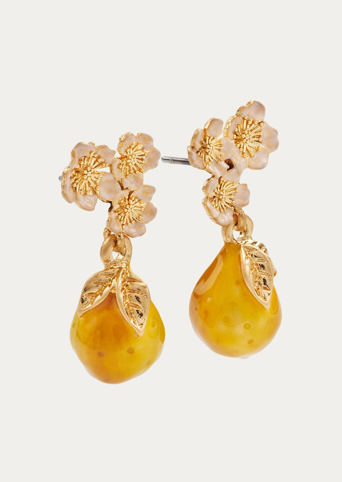 A pair of golden pear drop earrings adorned with light pink flowers.