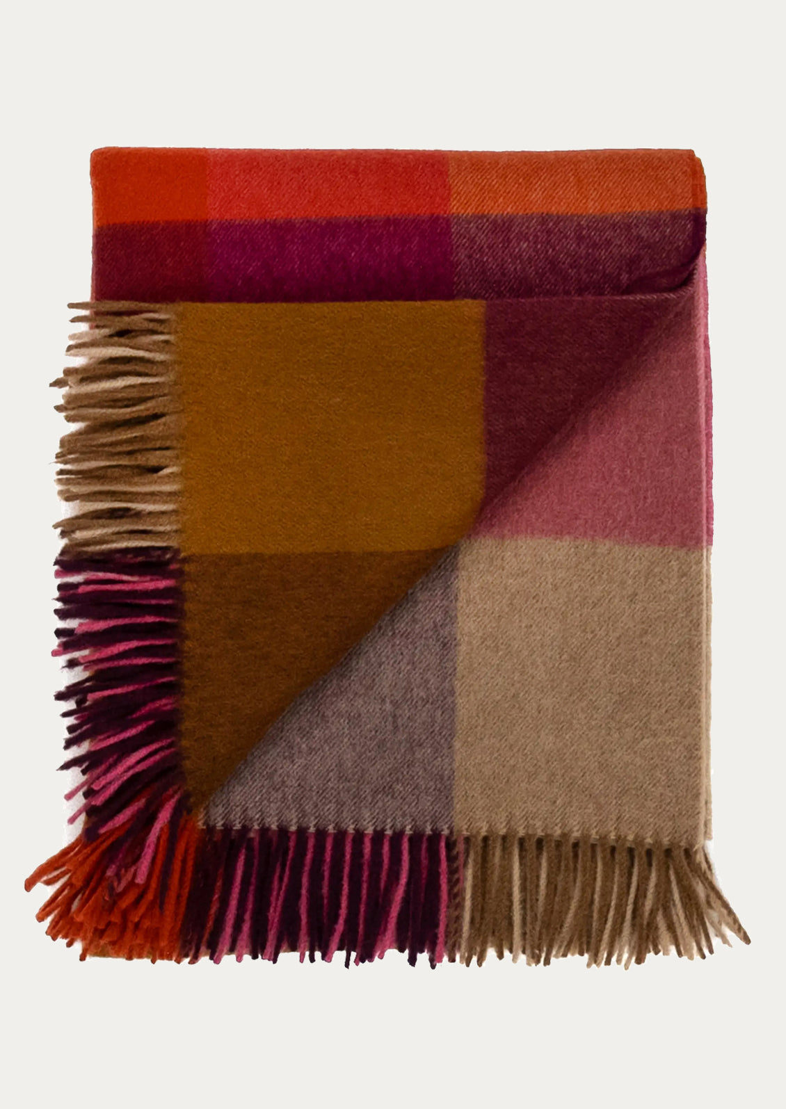 Colorful checkered blanket with fringes on a white background