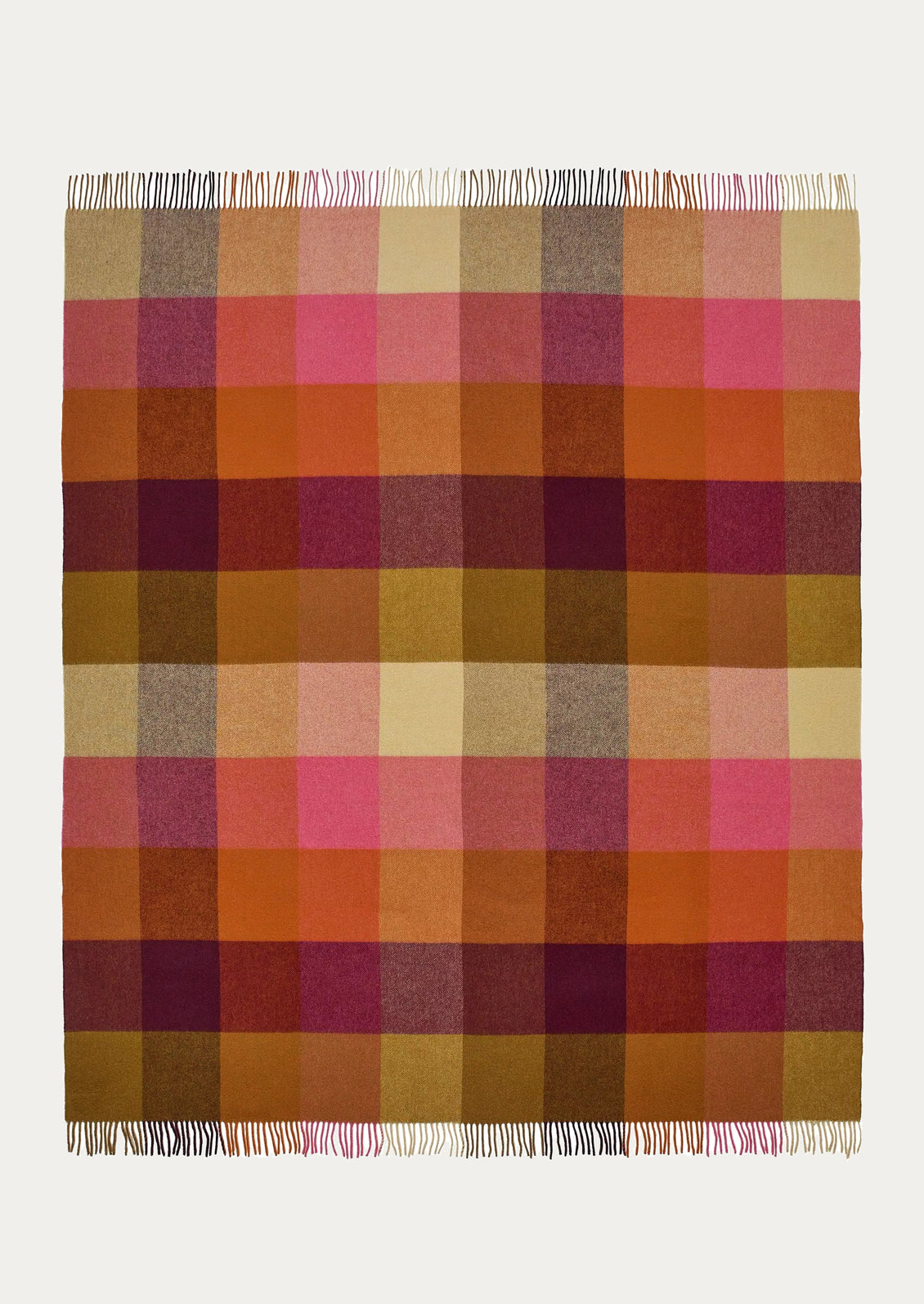 Plaid blanket with a checkered pattern in shades of orange, pink, and brown on a white background.