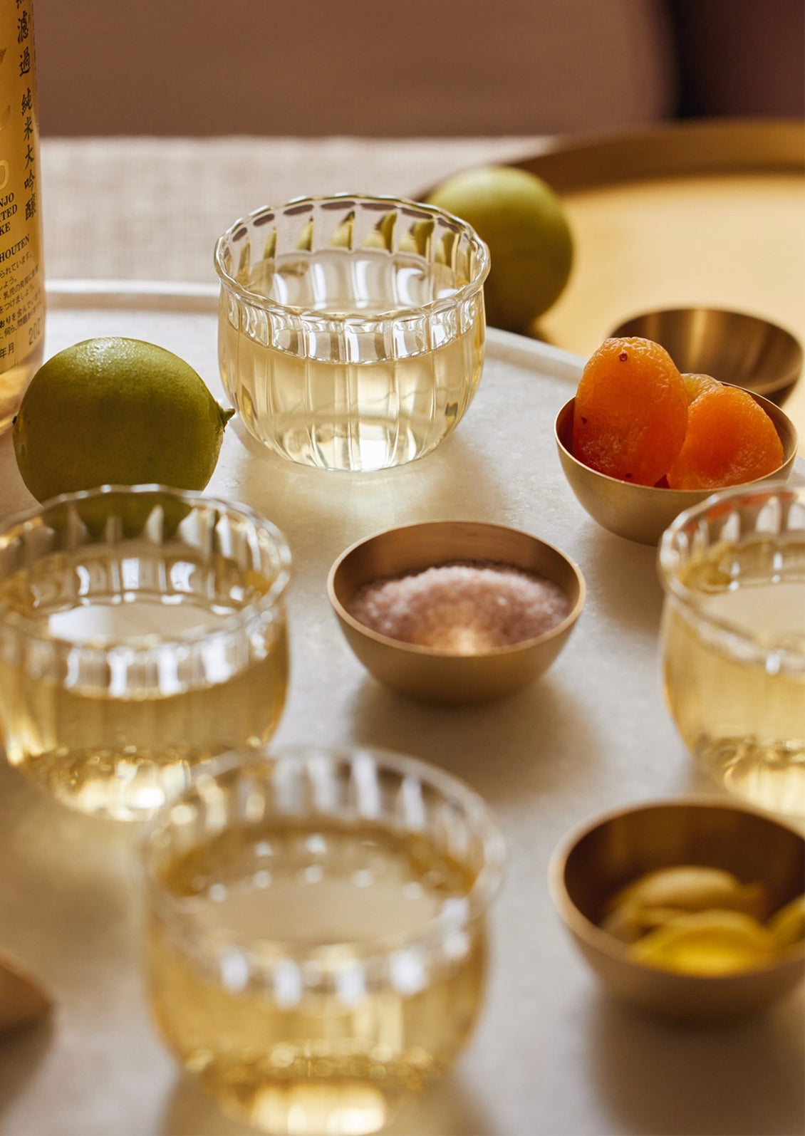 Small glass wine cups with fluted texture.