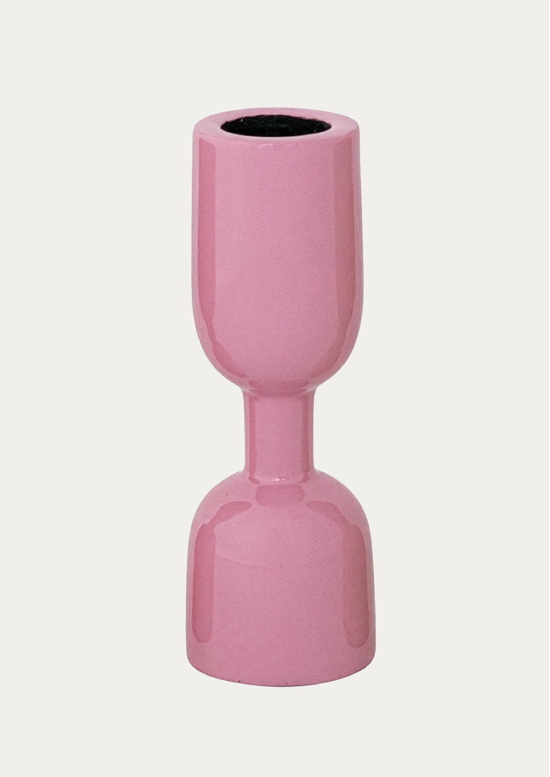 An enamel candle holder in pink.