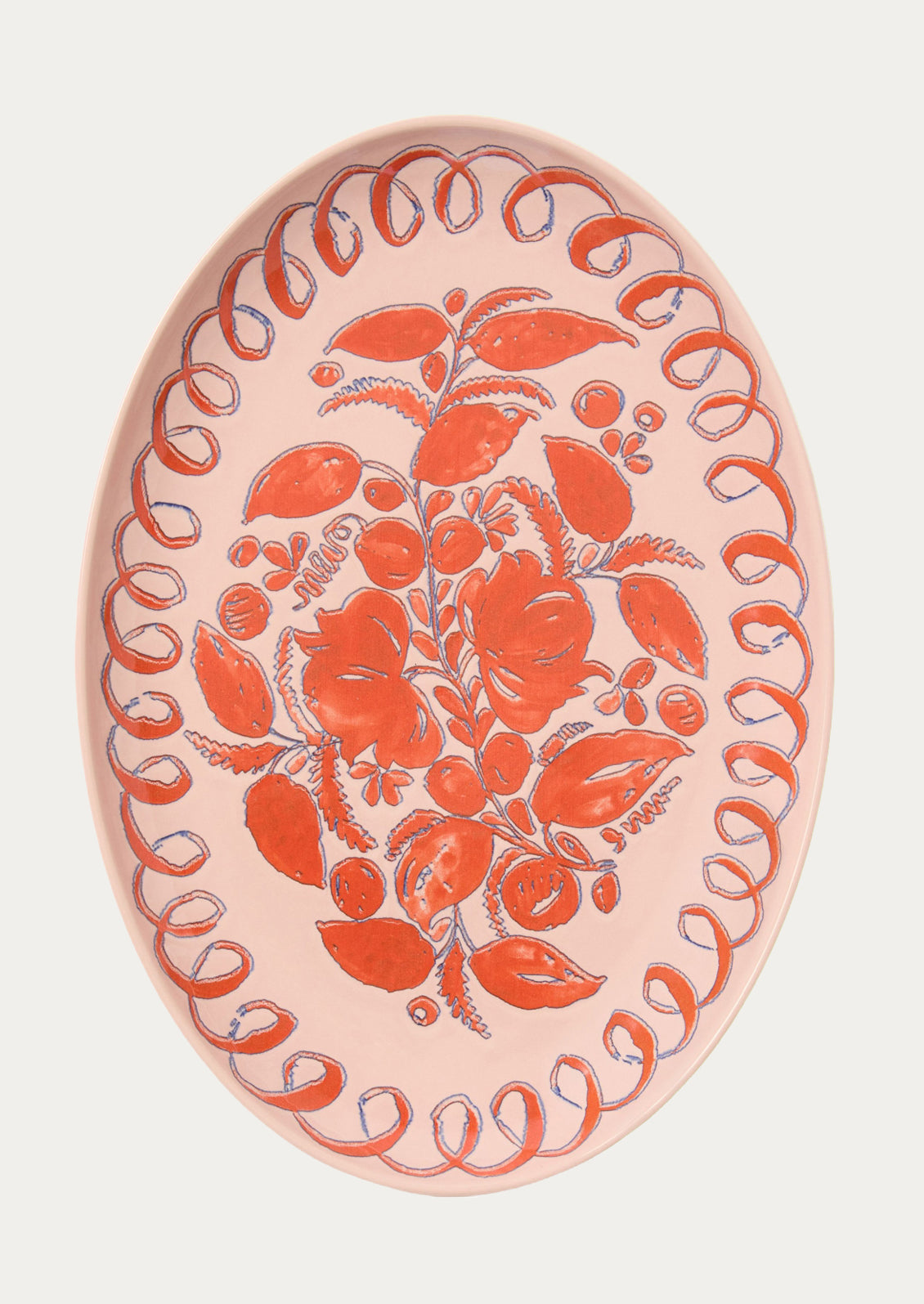 Decorative plate with orange floral design on a pink background