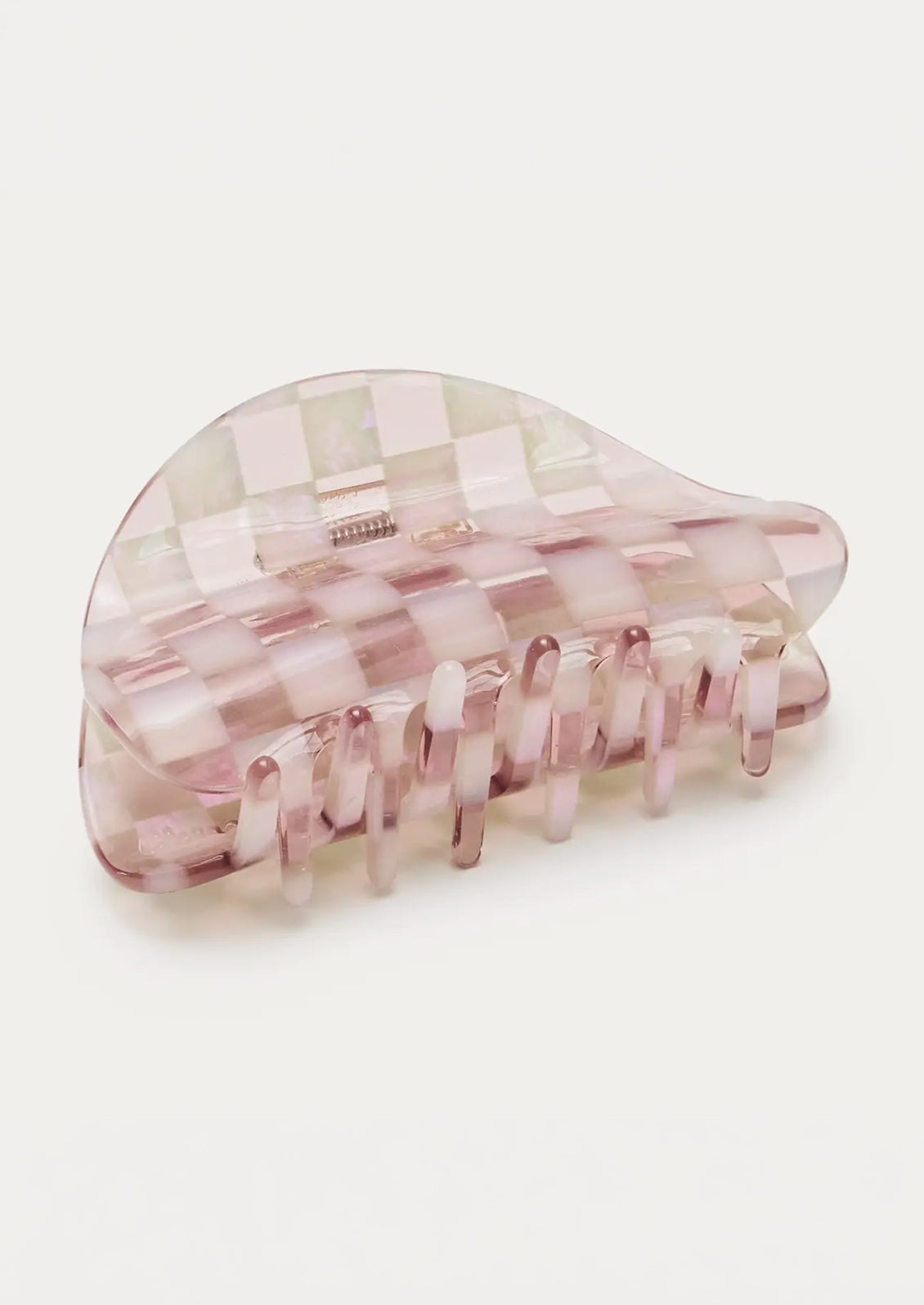A hair claw with a pink checkerboard pattern.