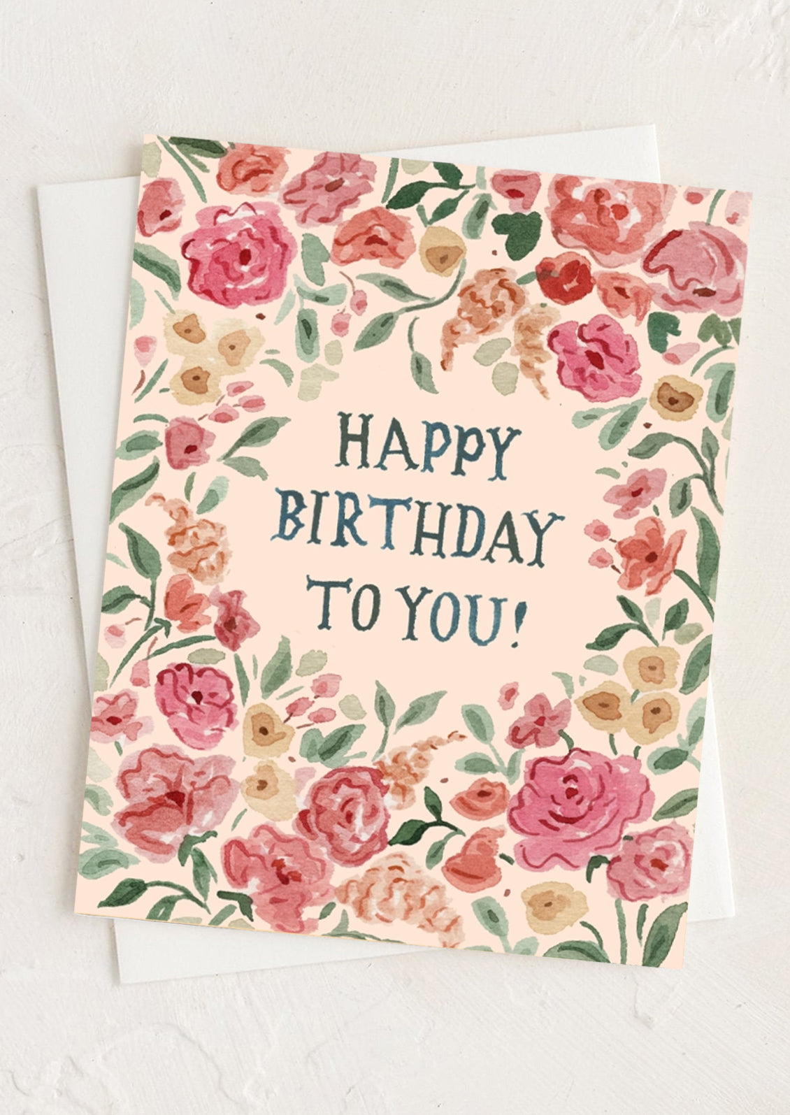 A pink floral print birthday card.