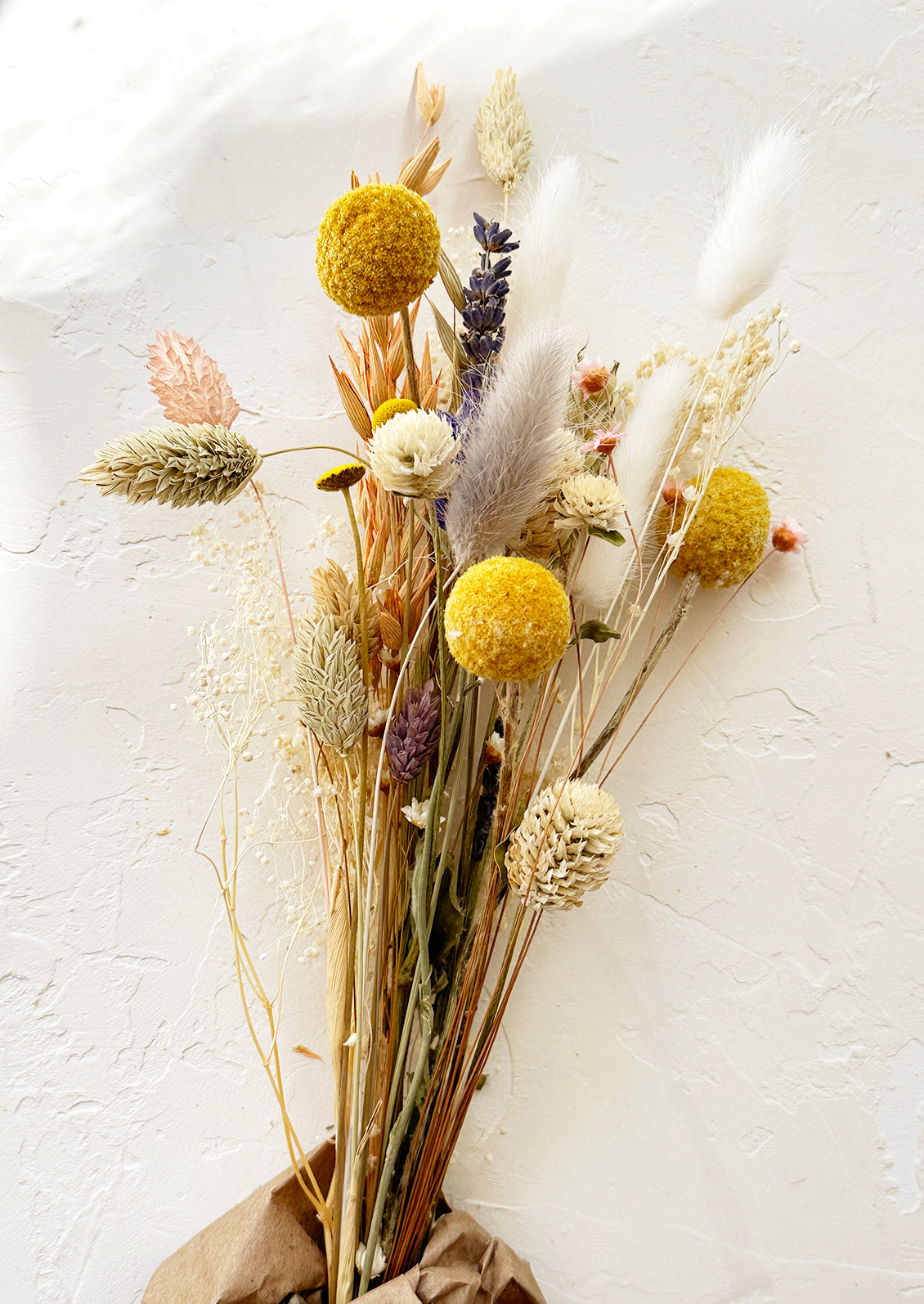 A dried bouquet in pink multi.