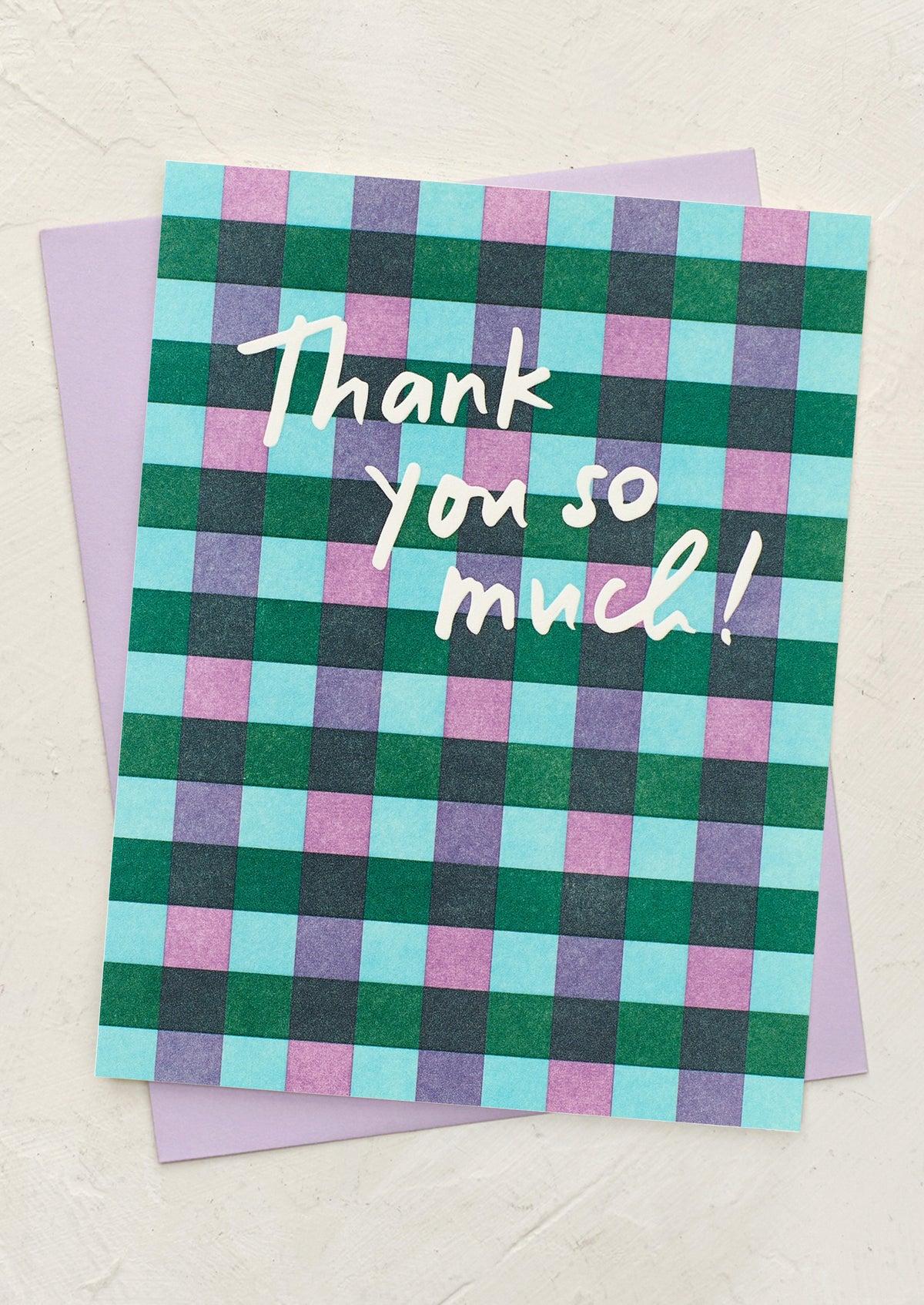 A plaid patterned greeting card reading "Thank you so much!".