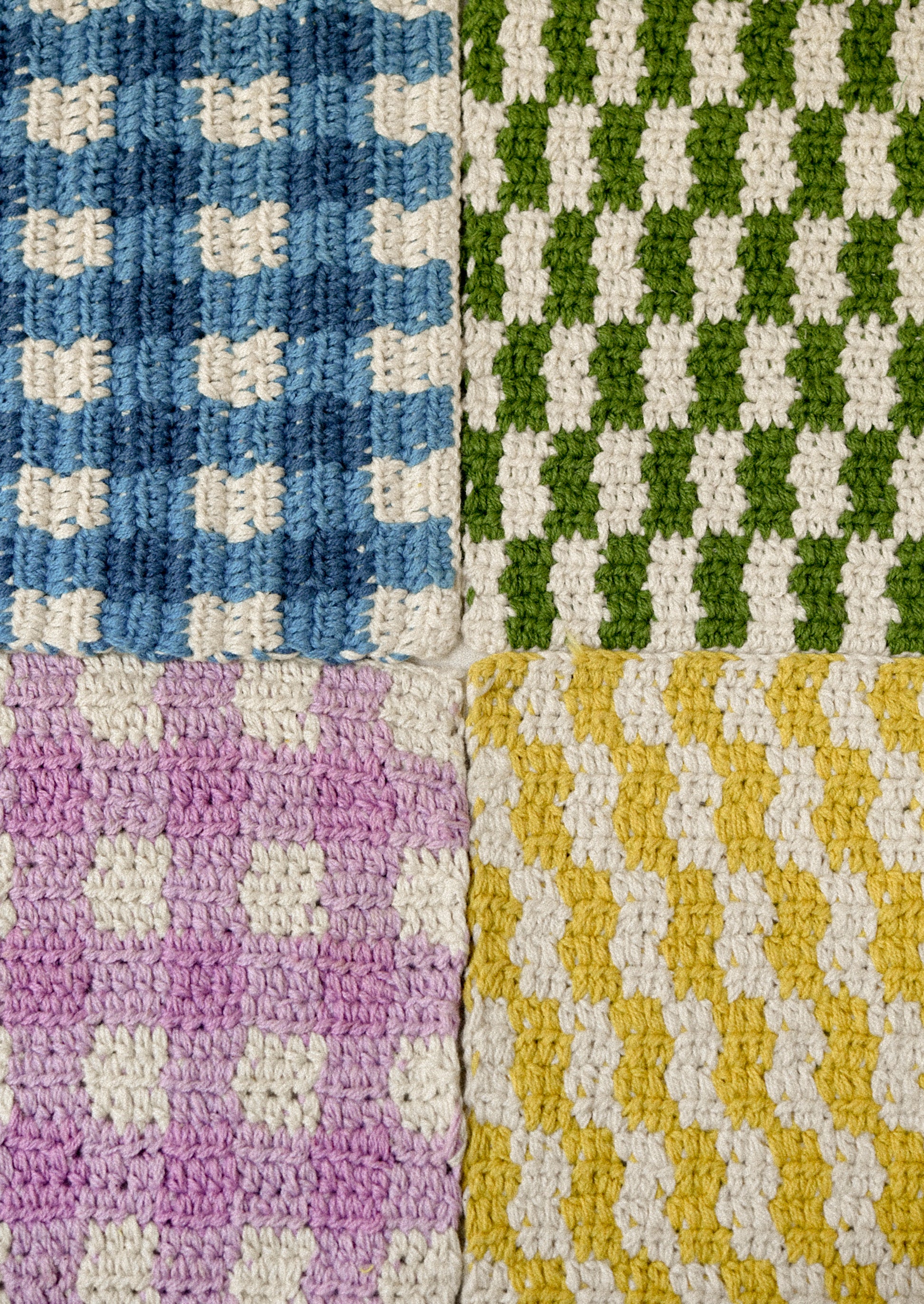Colorful plaid crocheted potholders.