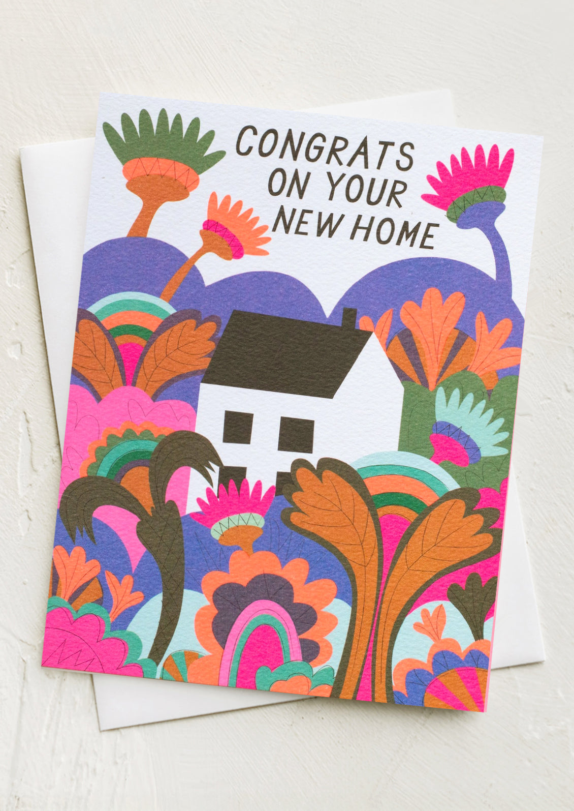 A card with illustration of a house in neon landscape, text at top reads "Congrats on your new home".