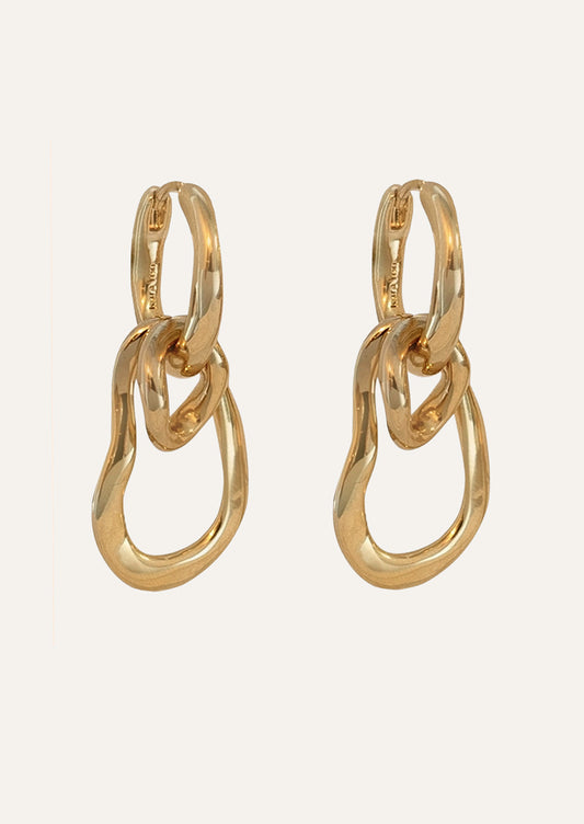 A pair of unique gold hoops earrings.
