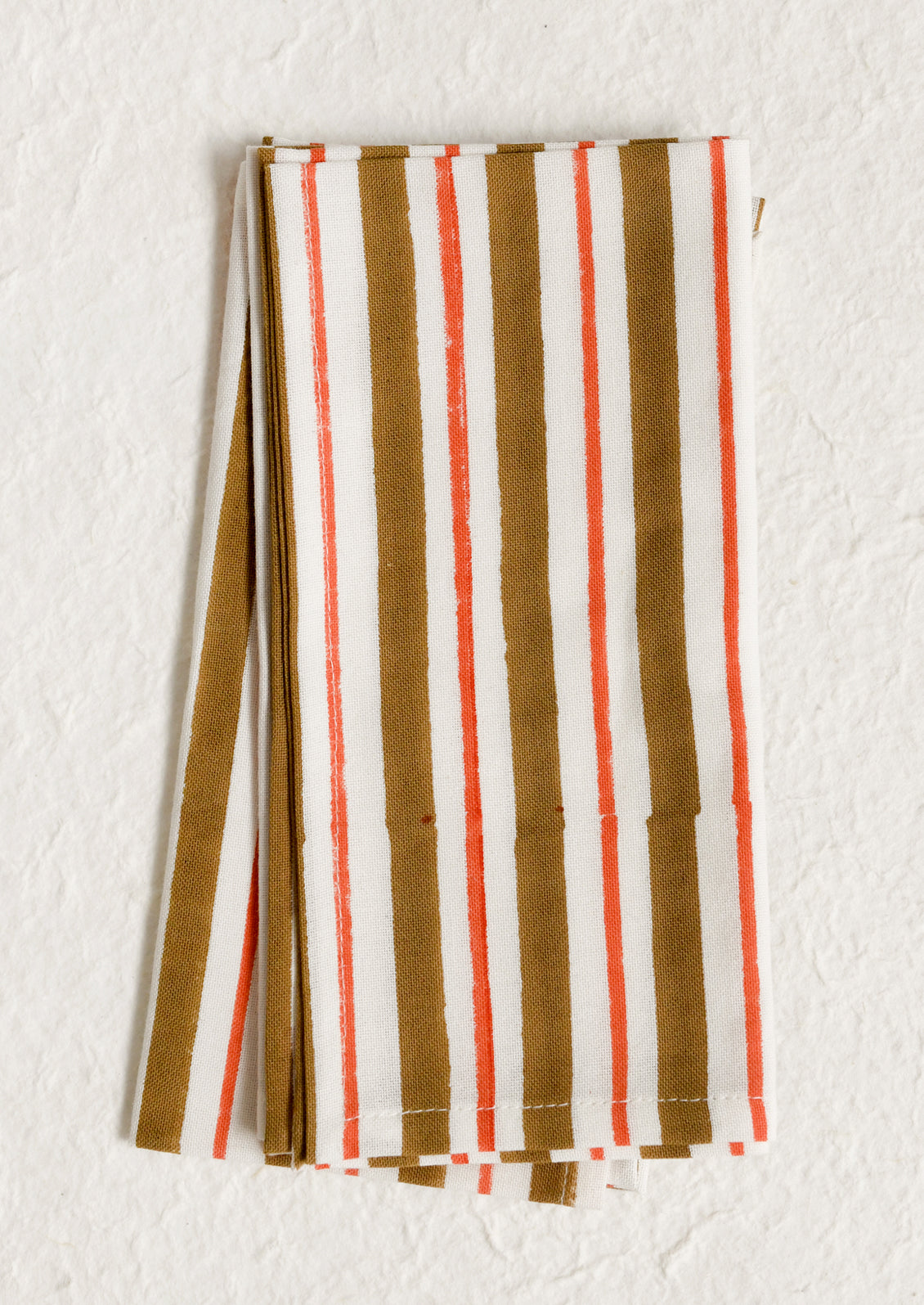 A pair of cotton napkins in ochre and neon orange stripe.