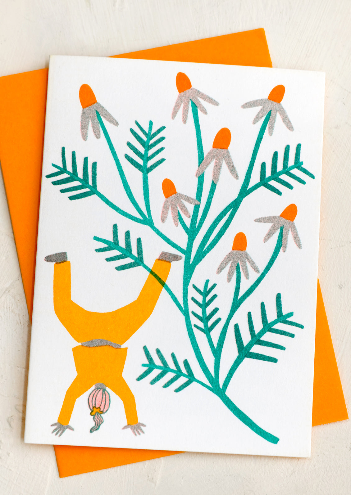 A risograph neon printed card with image of girl holding giant chamomle flower.