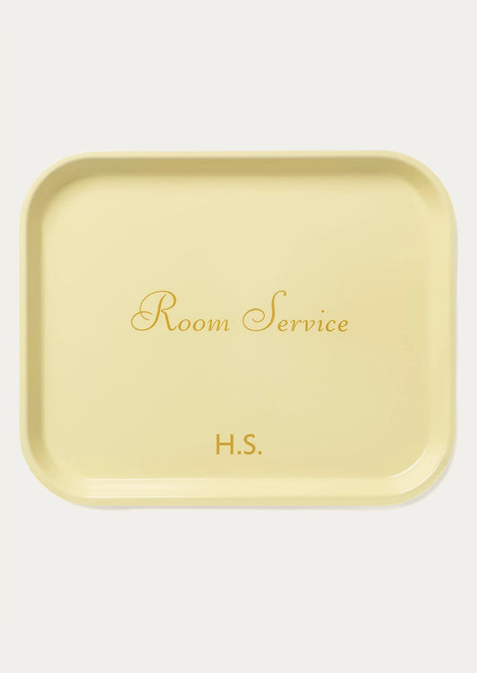 A butter yellow tray with text reading "Room Service".