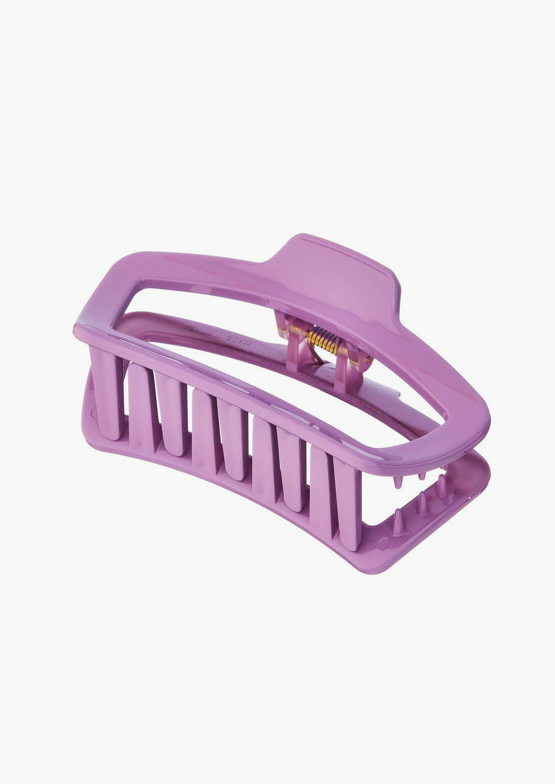 A rounded rectangle hair claw in lavender.