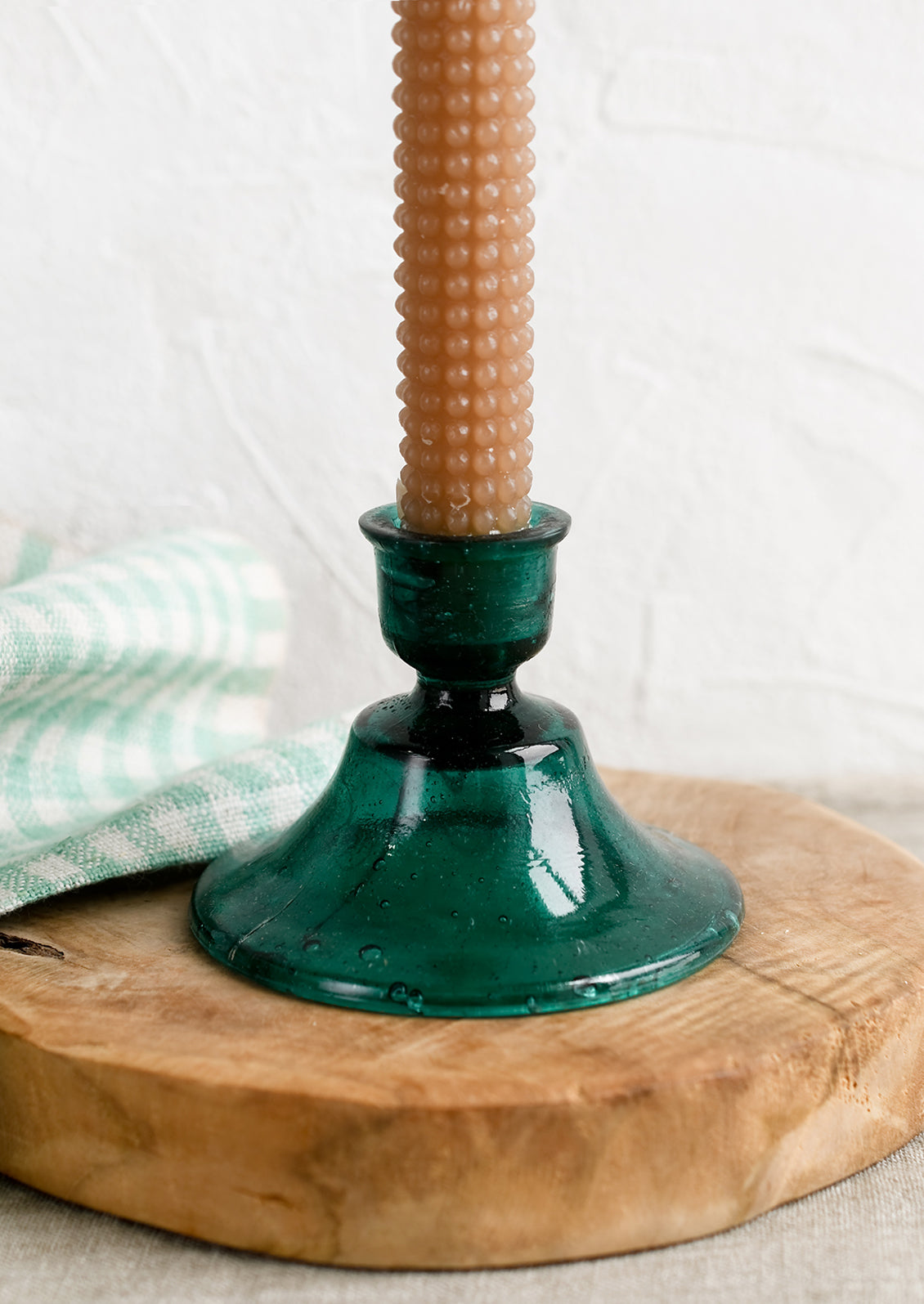 A Moroccan inspired glass taper holder in turquoise color.