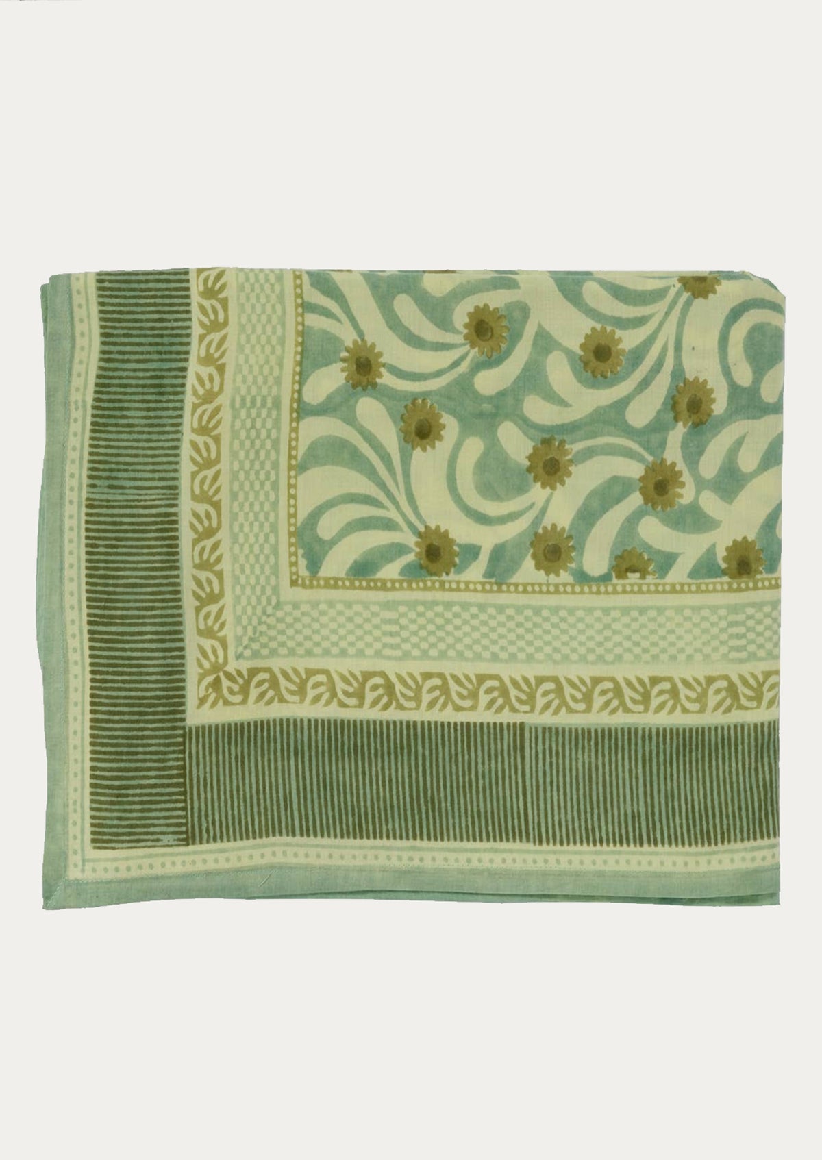 A green tablecloth with teal floral pattern and striped border.