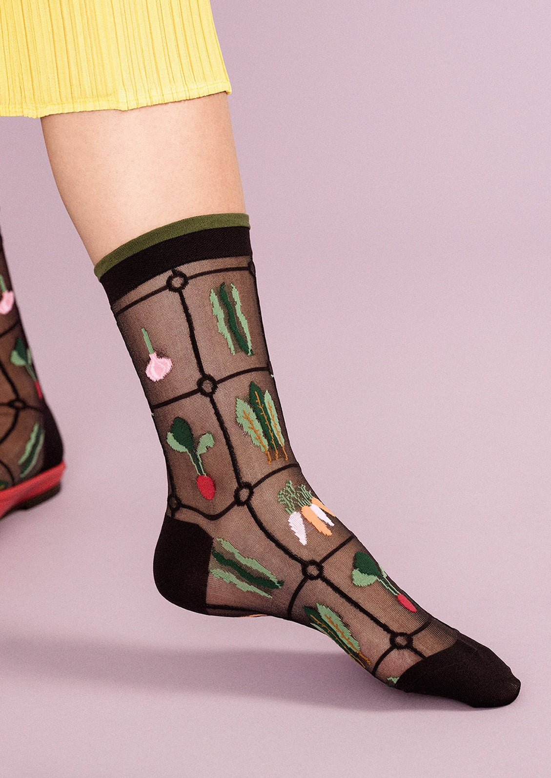 Sheer black nylon socks with multicolor veggie print.