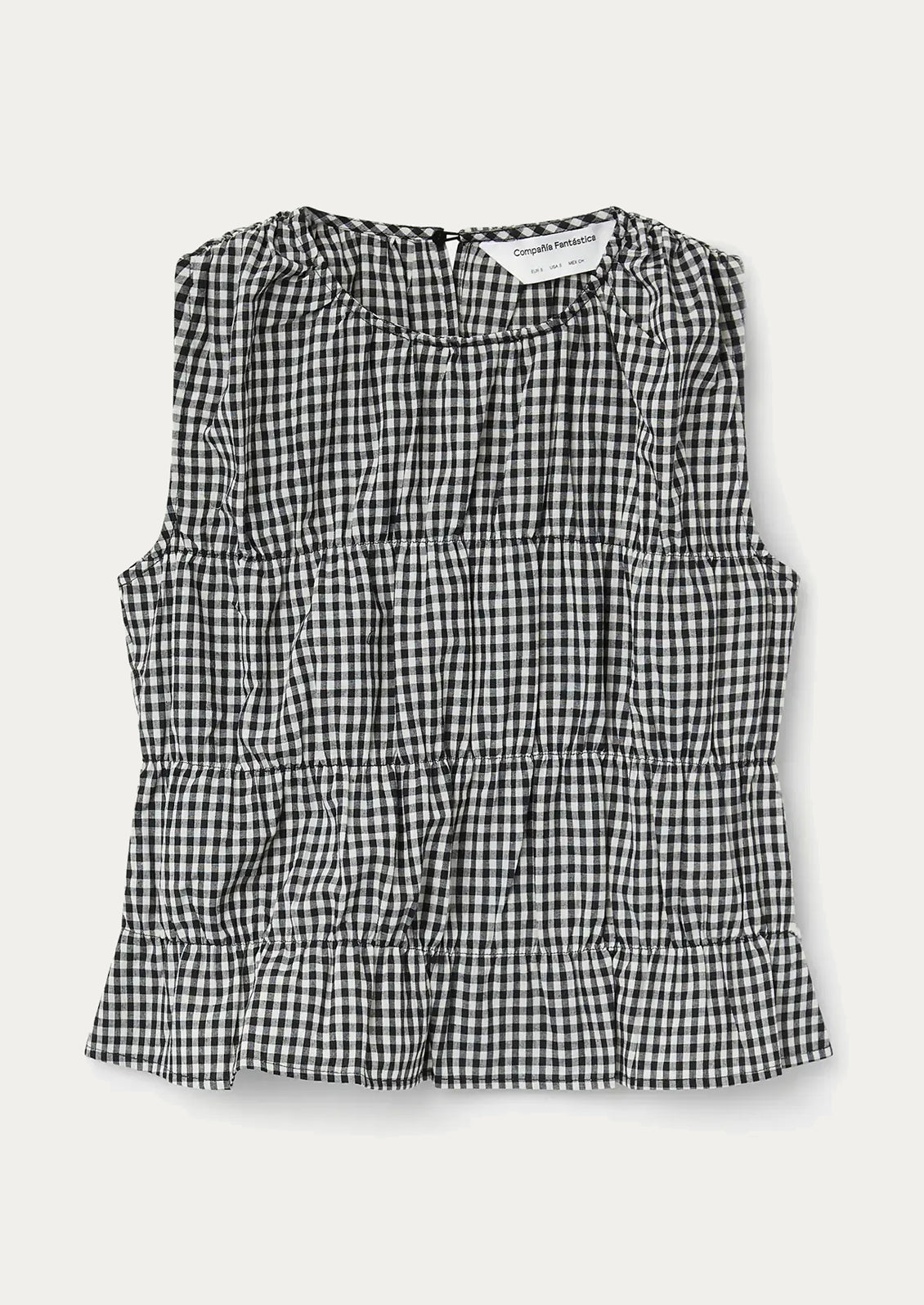 A black and white gingham sleeveless top.