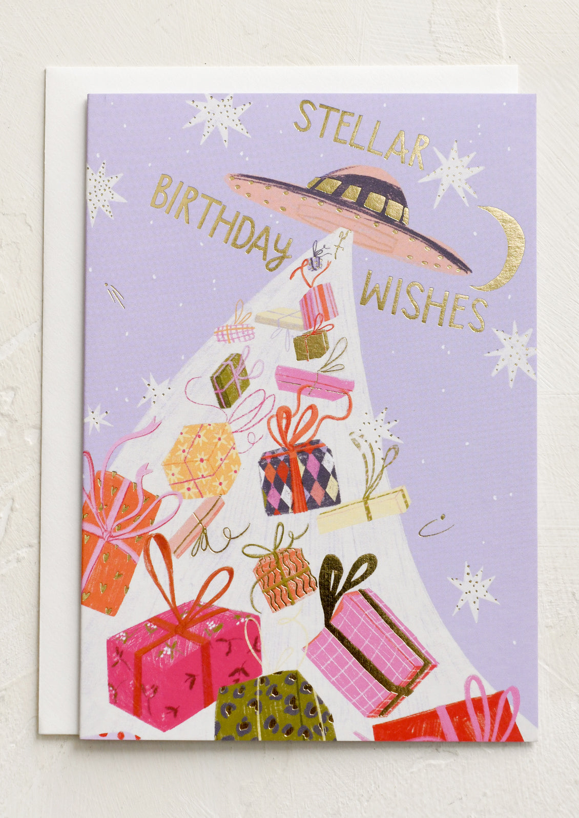 A card with image of UFO beaming down presents, text reads "Stellar birthday wishes".