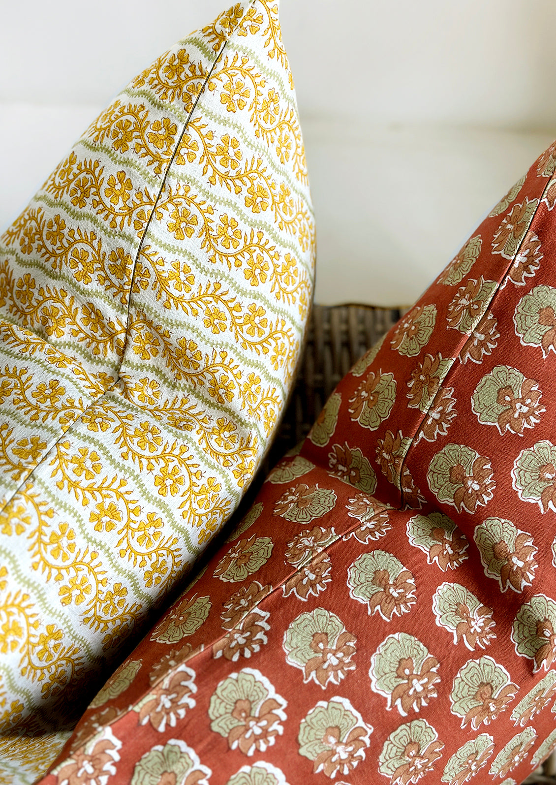 Two block printed lumbar pillows in different prints.