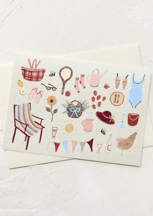 A greeting card with illustration of playful summer things like flowers, ice cream, and a bathing suit.