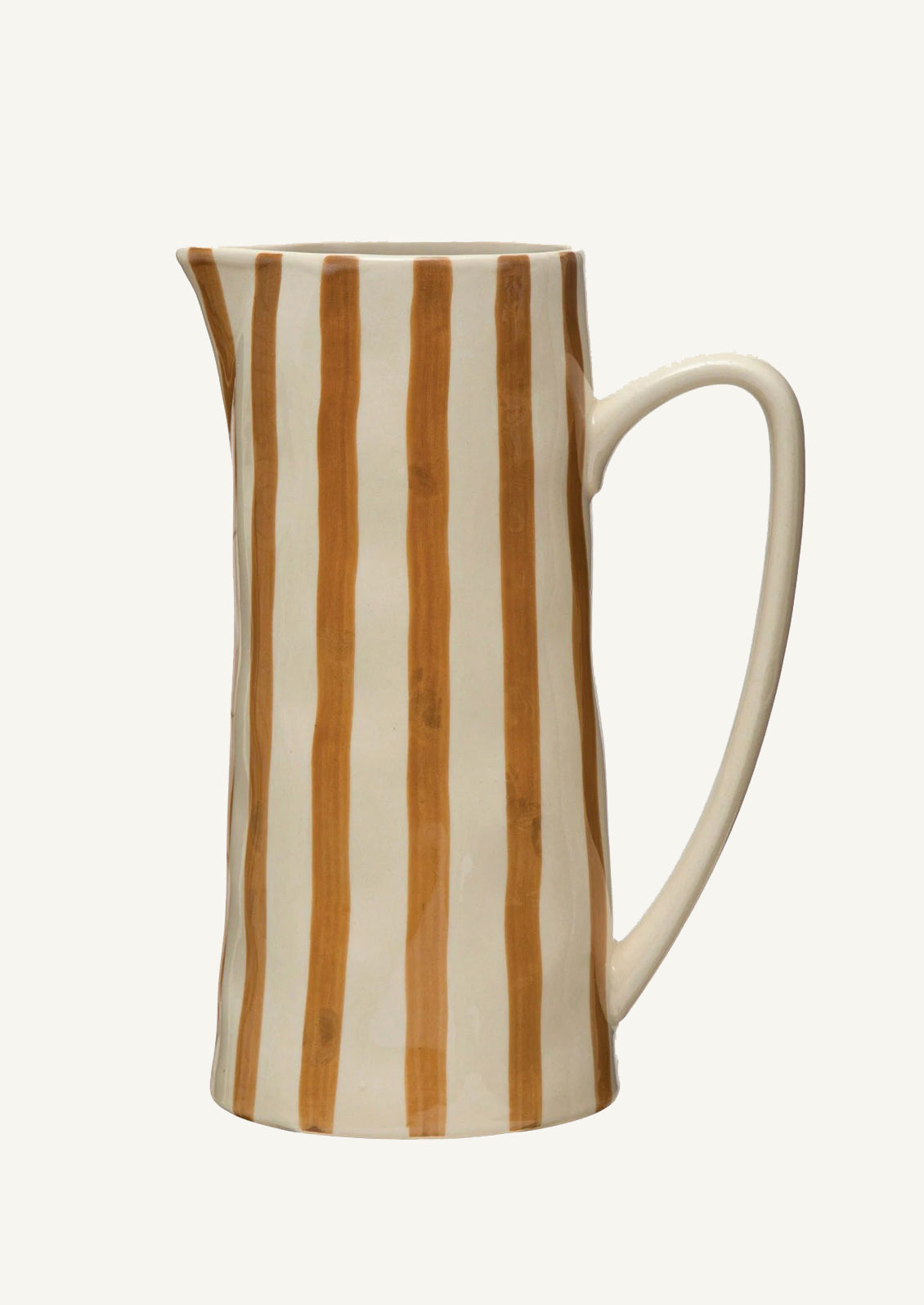 A tall ceramic pitcher in white with ochre vertical stripes.