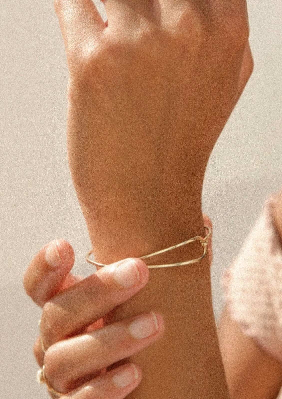 A minimal gold bracelet.