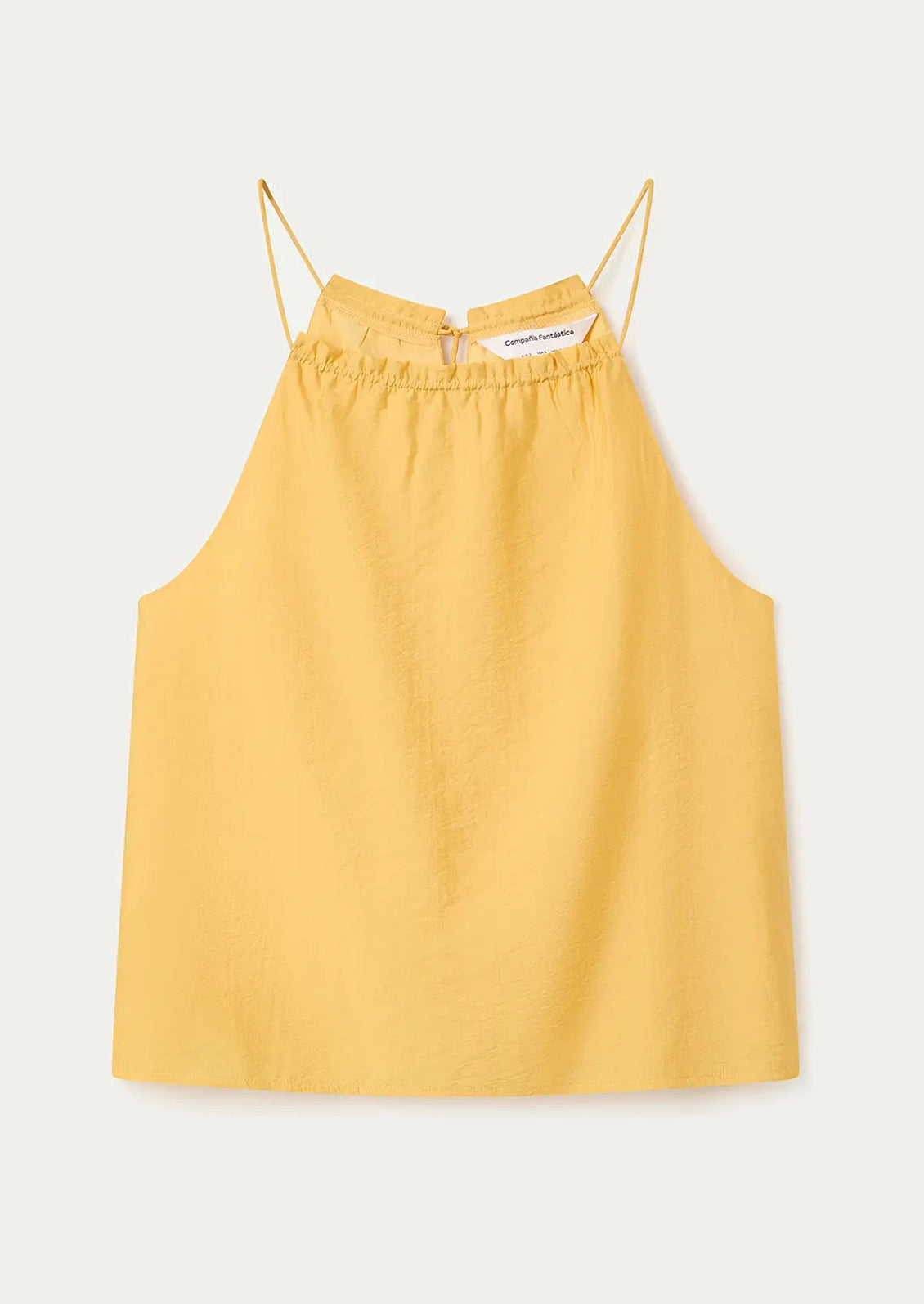 Yellow camisole top with thin straps on a white background
