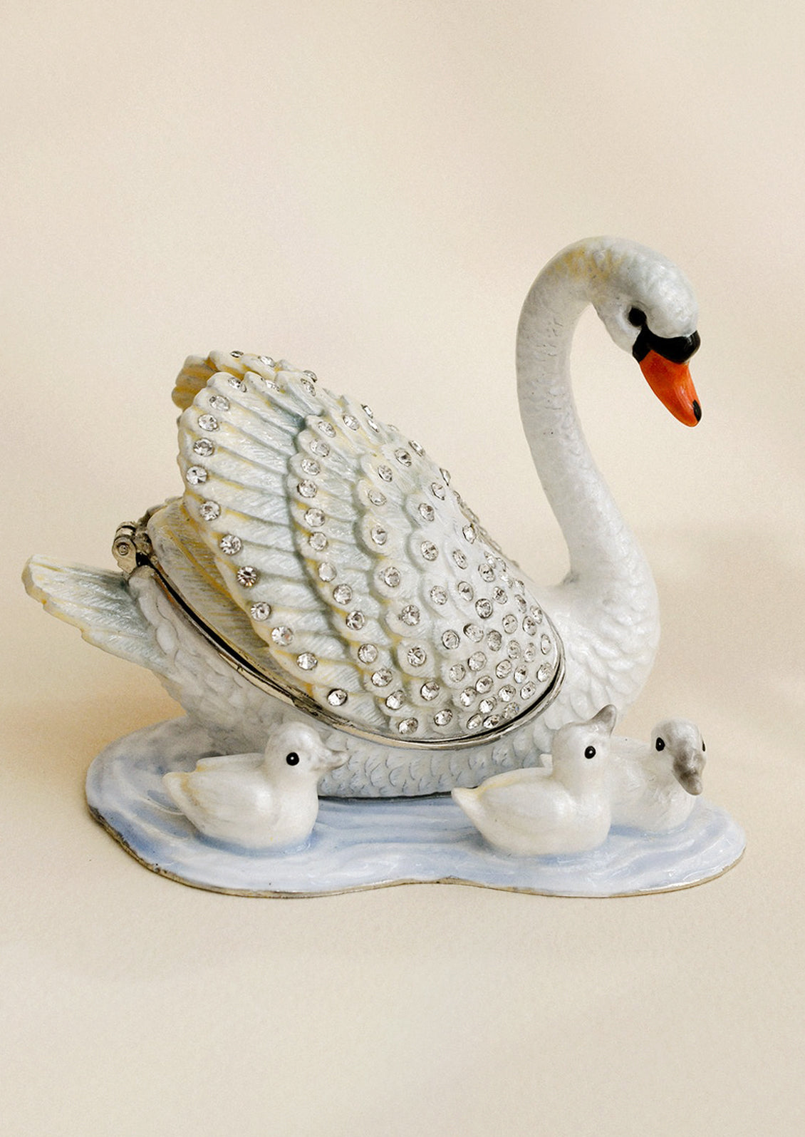 A crystal detailed metal trinket box depicting a swan with three baby swans.