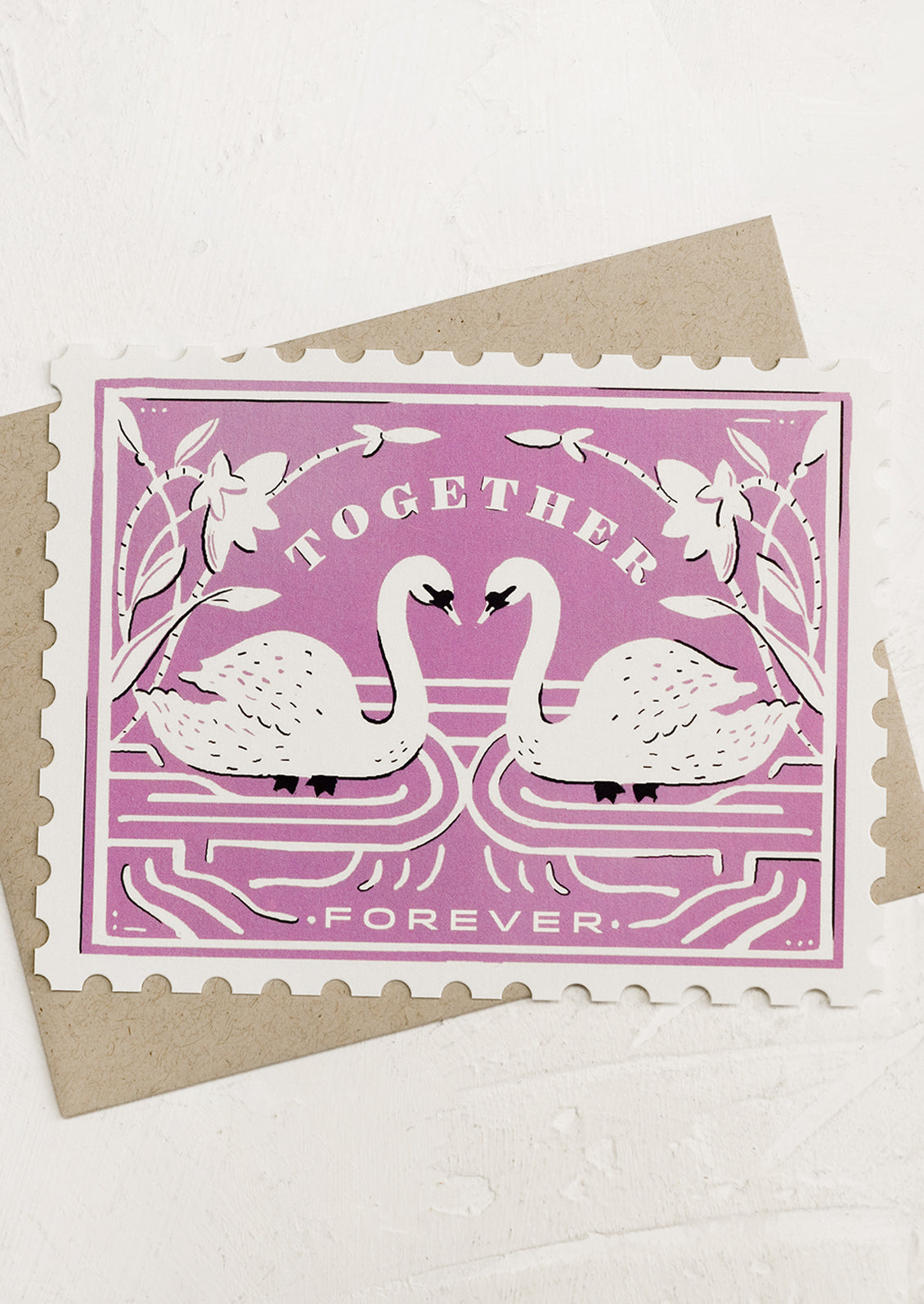 A diecut greeting card in the shape of a postal stamp, reading "Together forever".