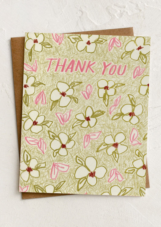 A green floral print thank you card.